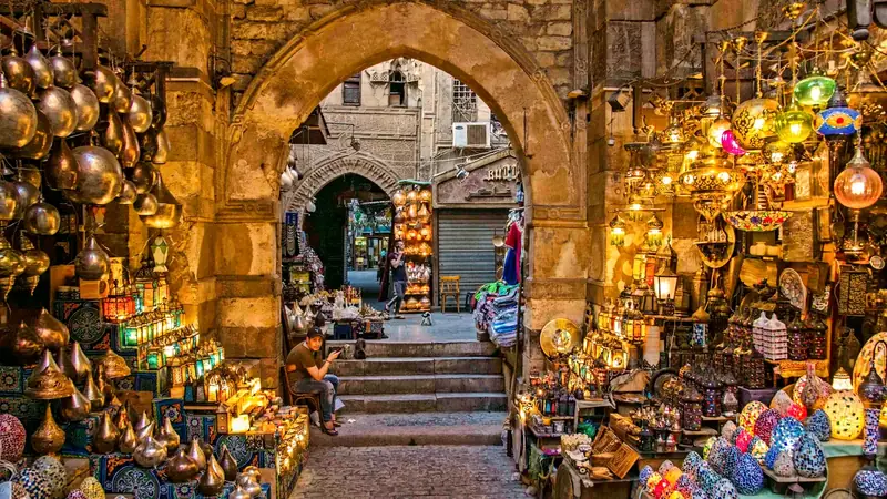 A stone archway over a lane of shops in the Khan el-Khalili bazaar