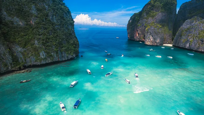 Limestone cliffs around the turquoise water of Maya Bay in the Phi Phi islands