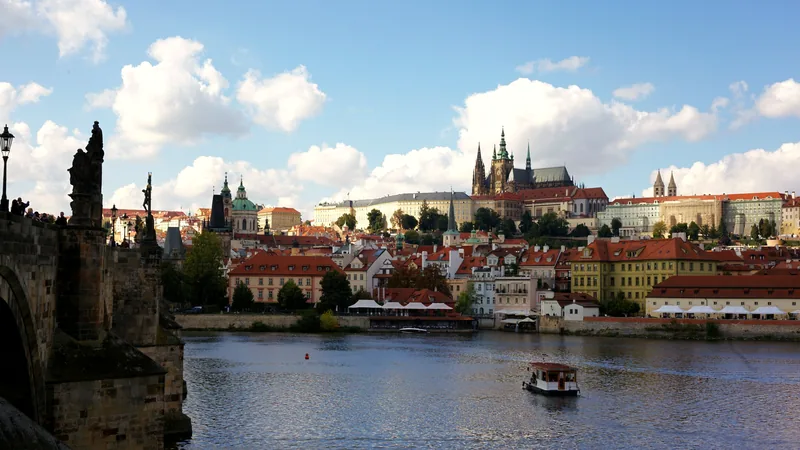 Prague Castle above the red roofs and the Vltava river