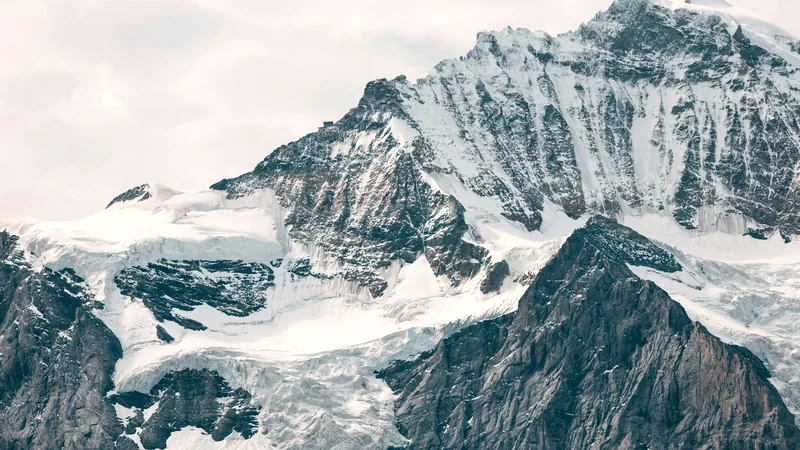 Snow-covered peaks of the Swiss Alps under a clear sky
